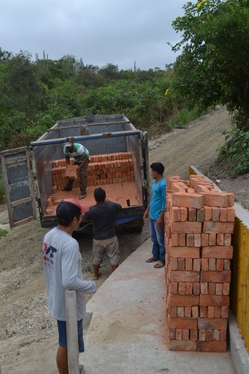 Wilter oversees brick unloading